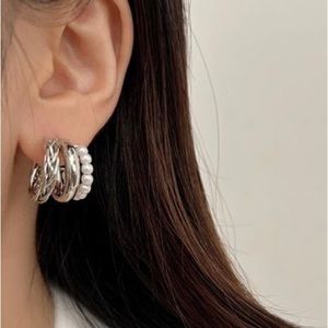 New fashion combined, braided and pearl earrings. Silver color.